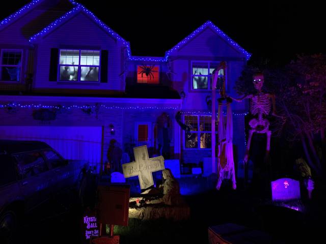 The Holiday Habits Halloween yard haunt lit up on Halloween night in 2022, Huntley, Illinois
