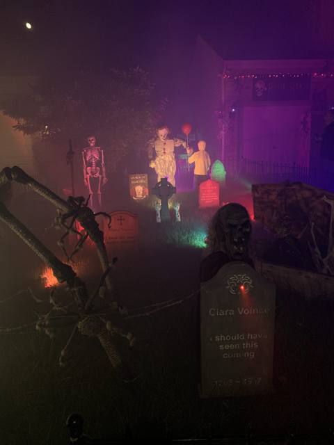 The Holiday Habits Halloween yard haunt lit up on Halloween night in 2022, Huntley, Illinois