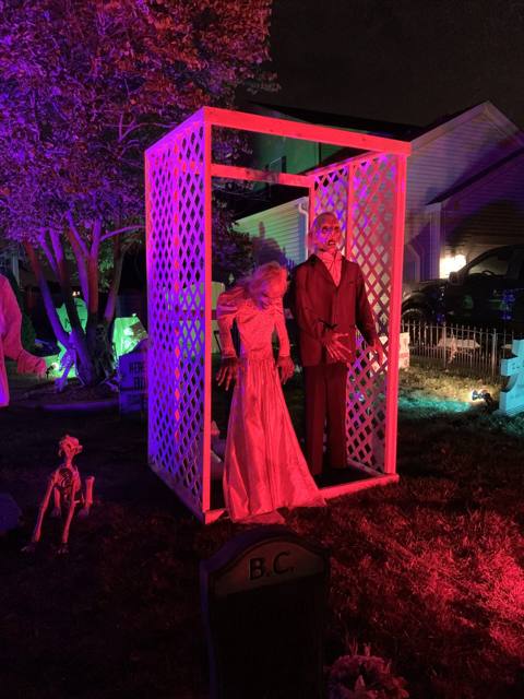 The Holiday Habits Halloween yard haunt lit up on Halloween night in 2022, Huntley, Illinois