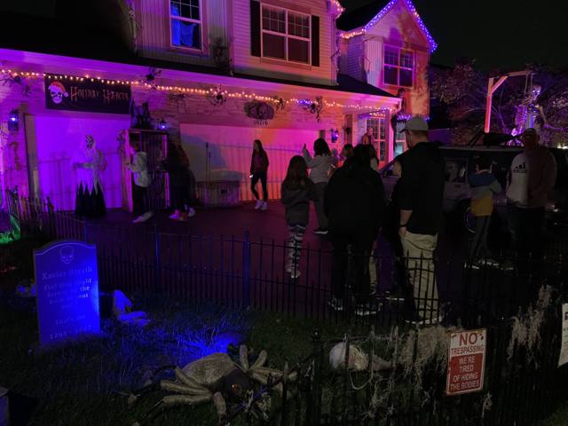 The Holiday Habits Halloween yard haunt lit up on Halloween night in 2022, Huntley, Illinois