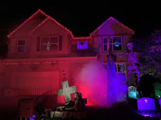 The Holiday Habits Halloween yard haunt lit up on Halloween night in 2022, Huntley, Illinois