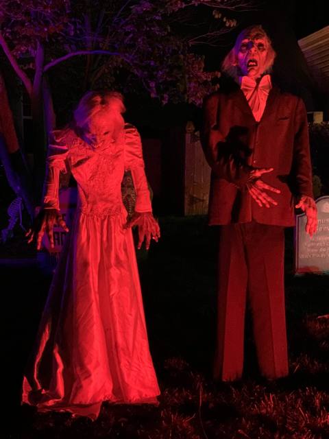 The Holiday Habits Halloween yard haunt lit up on Halloween night in 2022, Huntley, Illinois
