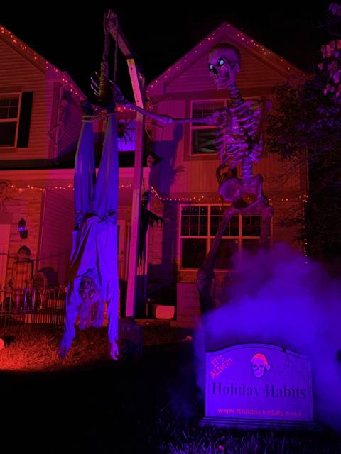 The Holiday Habits Halloween yard haunt lit up on Halloween night in 2022, Huntley, Illinois