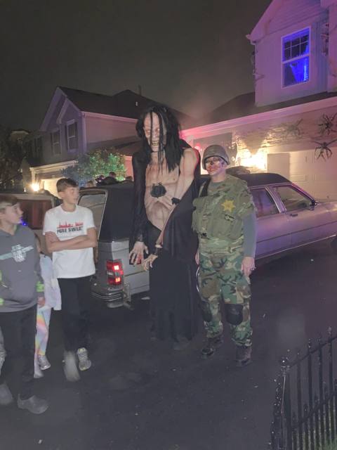 The Holiday Habits Halloween yard haunt lit up on Halloween night in 2022, Huntley, Illinois