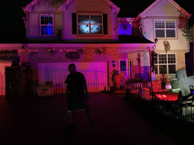 The Holiday Habits Halloween yard haunt lit up on Halloween night in 2022, Huntley, Illinois
