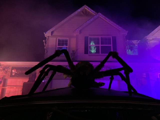 The Holiday Habits Halloween yard haunt lit up on Halloween night in 2022, Huntley, Illinois