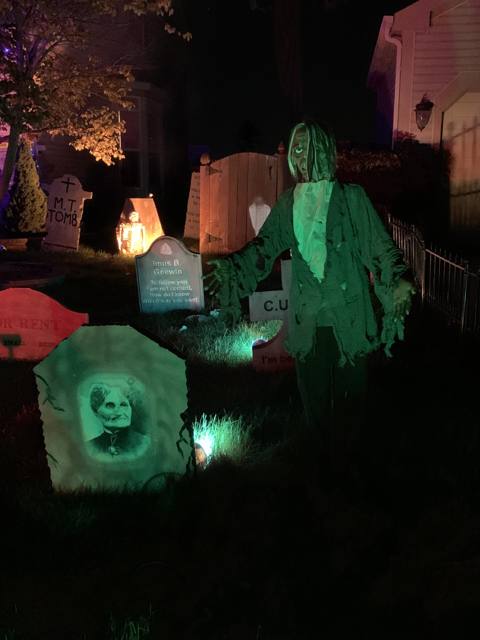 The Holiday Habits Halloween yard haunt lit up on Halloween night in 2022, Huntley, Illinois