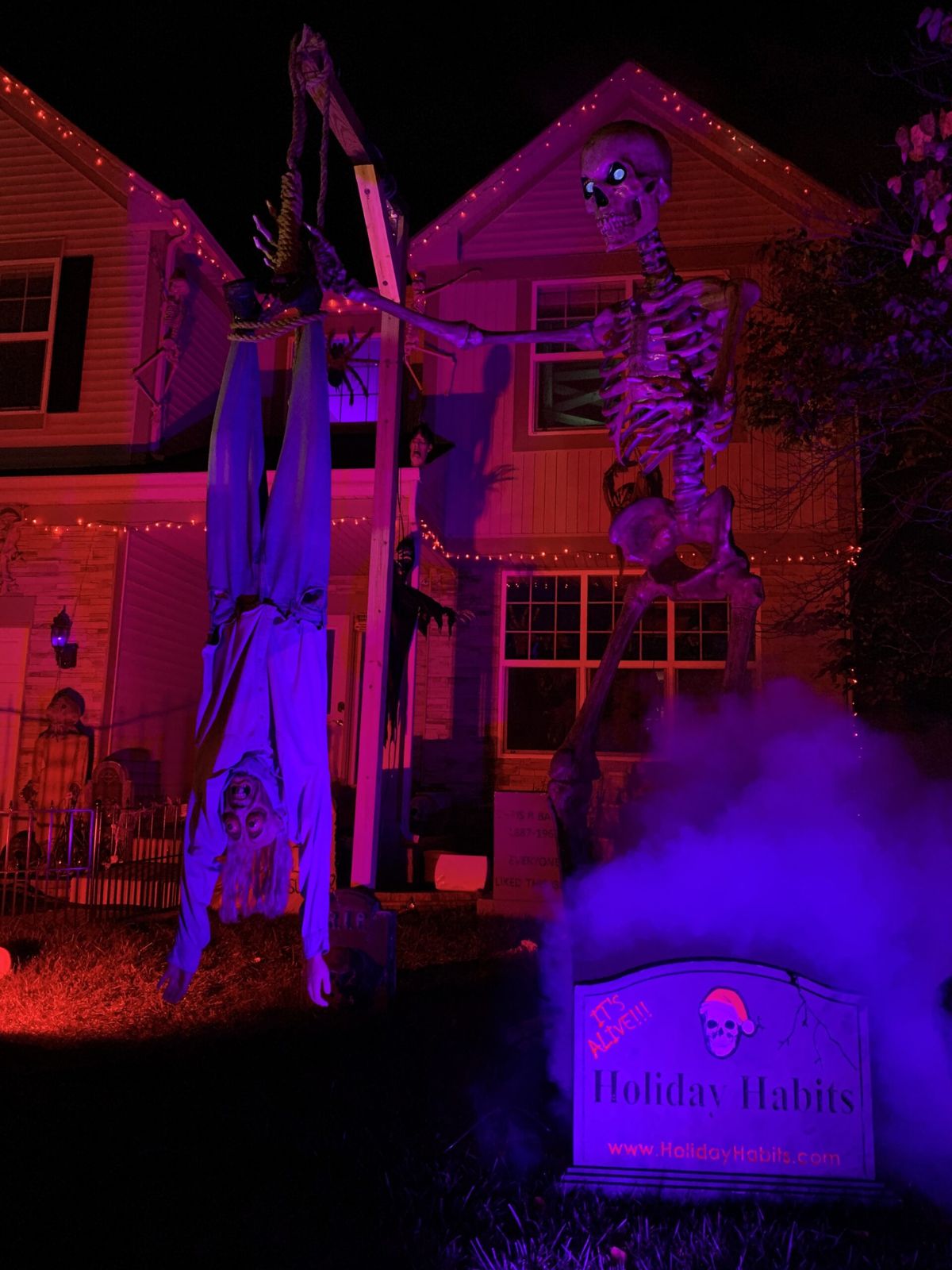 The Holiday Habits Halloween yard haunt lit up on Halloween night in 2022, Huntley, Illinois