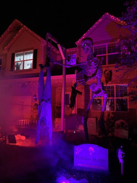 The Holiday Habits Halloween yard haunt lit up on Halloween night in 2022, Huntley, Illinois